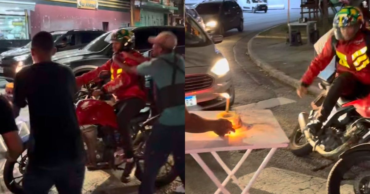 Motoboy ganha aniversário surpresa no farol, mas bolo explosivo gera revolta com chute na mesa
